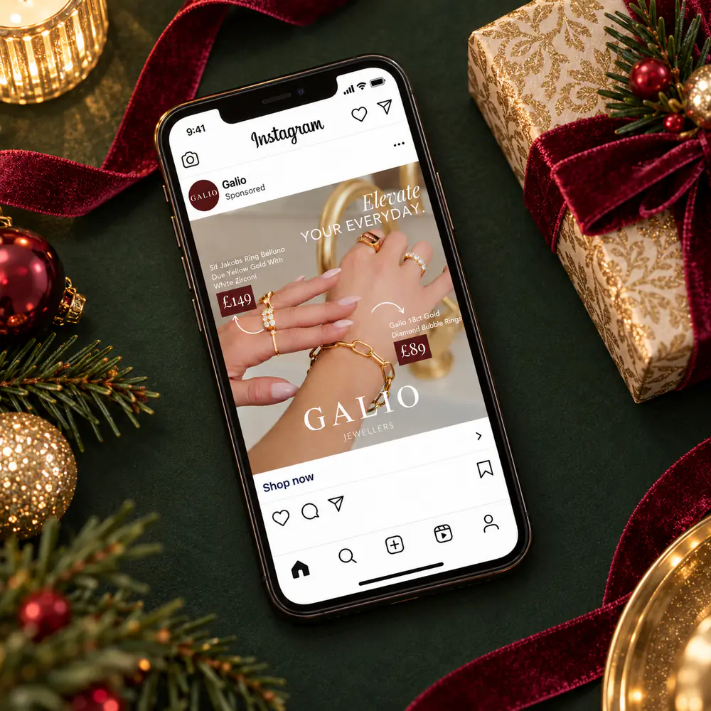 Galio Jewellers Instagram ad for gold rings on a phone in a festive flat lay