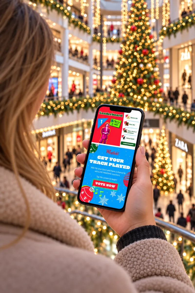 Shopper voting for a Christmas track on the Westfield music voting app